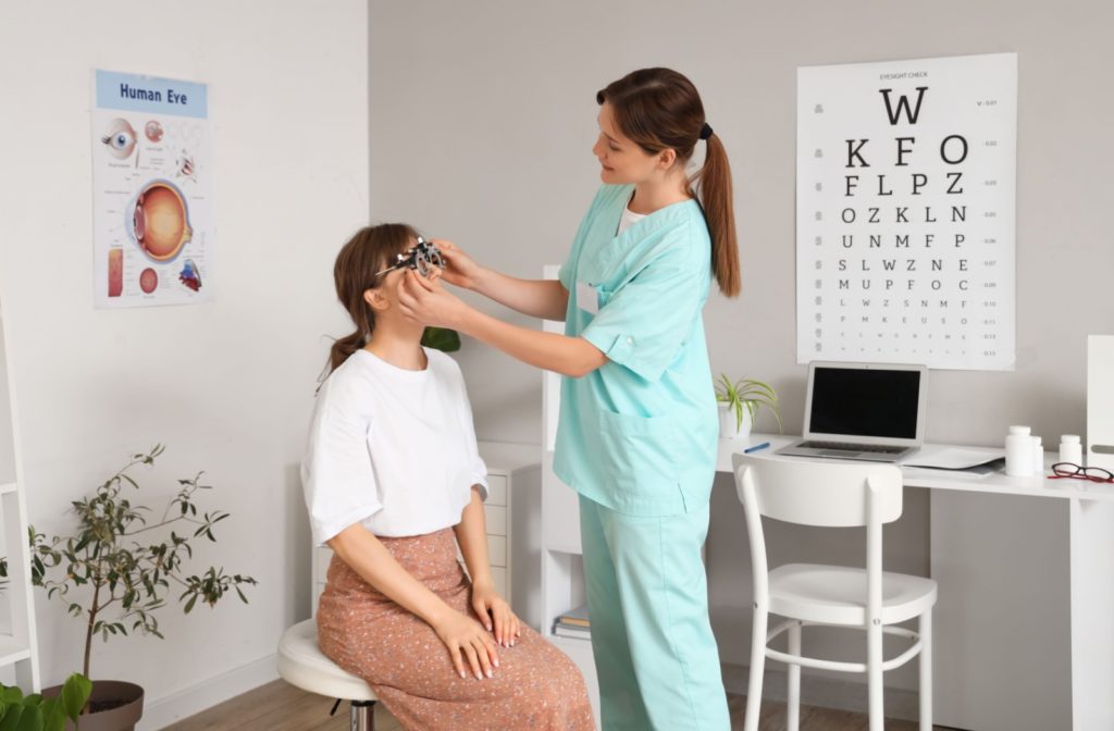 An Ontario optometrist assesses their patient's visual acuity during a routine eye exam.