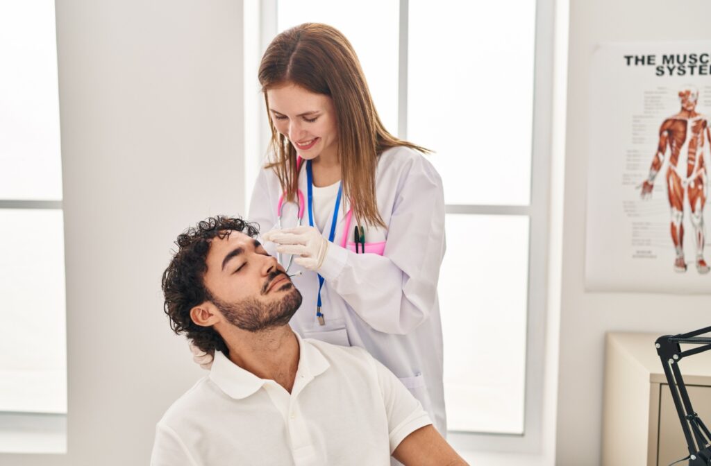 A patient having their eyes treated for dry eye from their local optometrist.